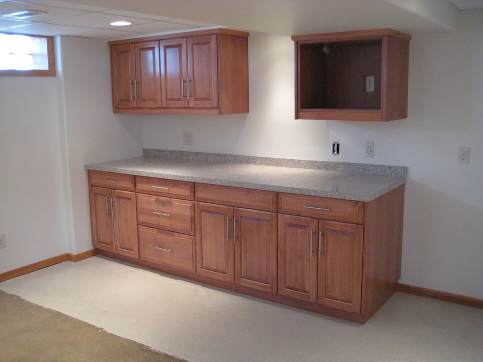 Hard maple kitchenette finished with stain and white glaze.
