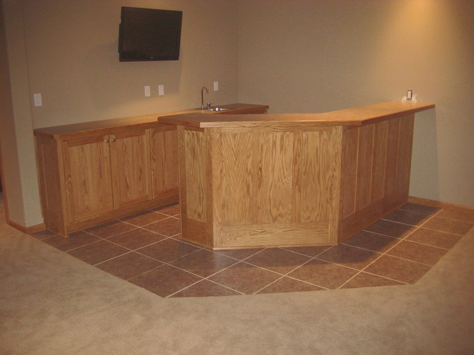 Red oak bar and storage cabinets.
