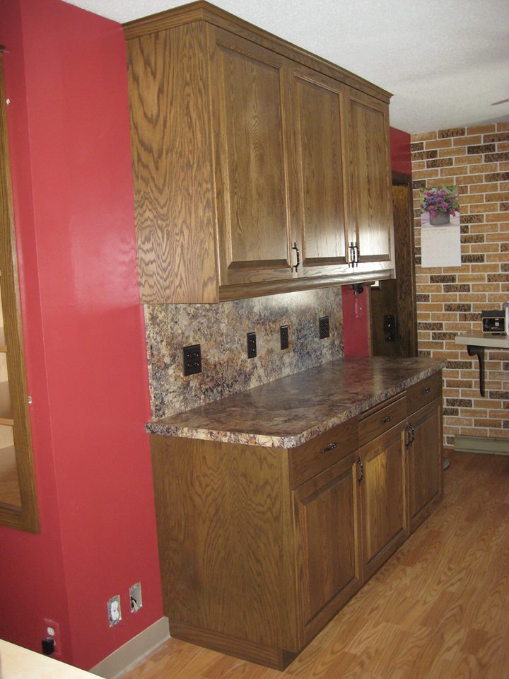 Red oak kitchen cabinets with a custom dark walnut stain.