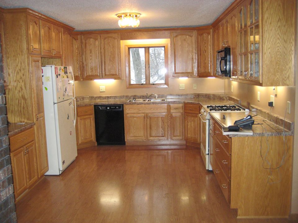 Red oak kitchen with stain and satin lacquer finish.