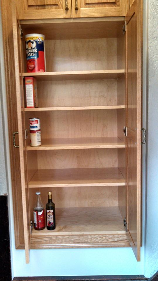 Red oak pantry with clear finish. Interior is hard maple with fully adjustable shelving.