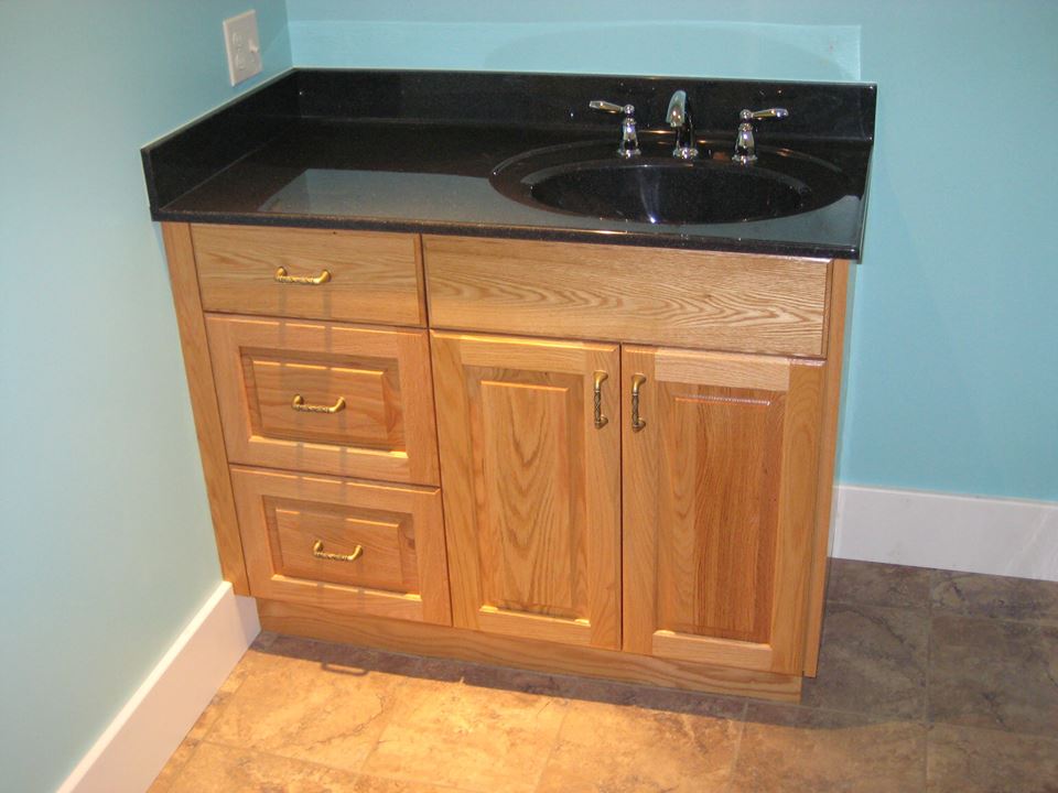 Red oak vanity finished with satin lacquer.
